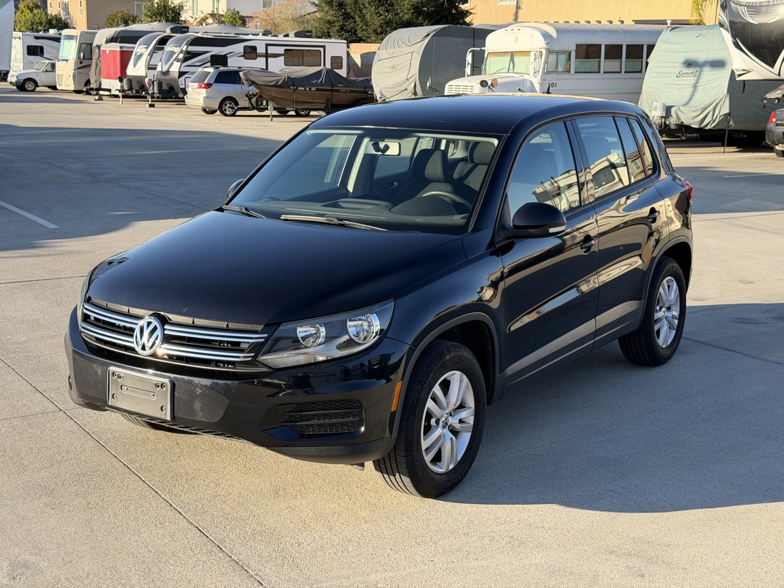 Front three-quarter exterior view of the black 2012 Volkswagen Tiguan S